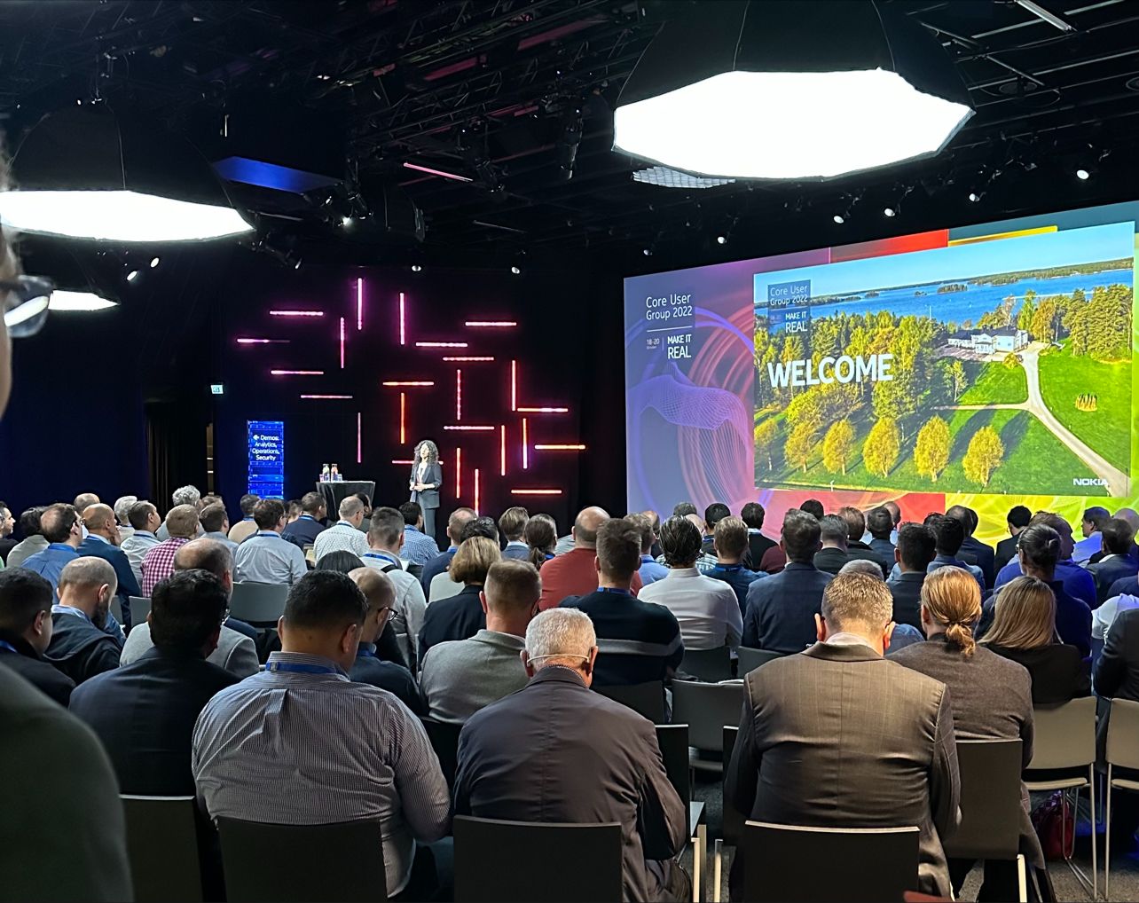 Attendees at the Nokia Core User Group 2022 event, where customers are engaging with presentations on topics like Network as Code.