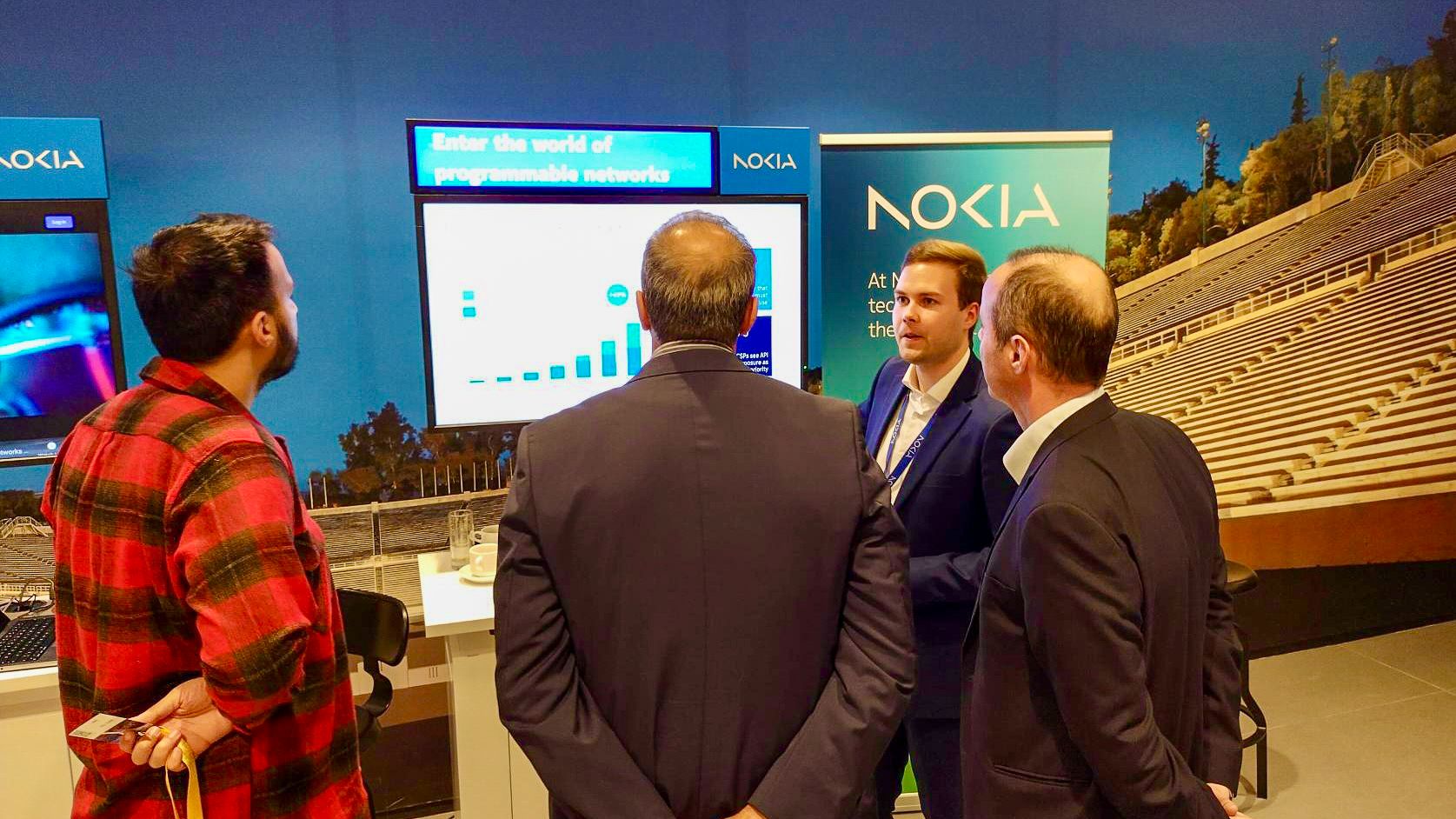 Lauri Alho demonstrating Network as Code and programmable networks to attendees in Athens at Nokia Greece Amplify 2023 event.