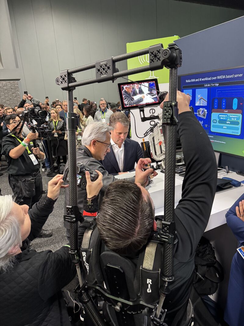 Lauri Alho's picture of NVIDIA CEO Jensen Huang signing a Nokia 5G radio unit next to Nokia CEO Justin Hotard. The display highlights Nokia RAN and AI workloads running on NVIDIA-based servers of a live demonstration of the Nokia AI-RAN and Network as Code platform, featuring NVIDIA GPUs integrated into Nokia 5G radios, at NVIDIA GTC DC. 