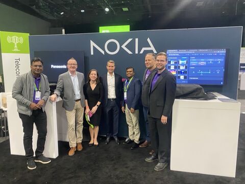 Lauri Alho, Nokia CEO Justin Hotard, Chief of Staff Victoria Hanrahan, Chief Development Officer Konstanty Owczarek, among other colleagues standing in a group photo at the Nokia booth at NVIDIA GTC DC demonstrating the Nokia Network as Code platform and AI-RAN capabilities for real-time AI in a 5G network.