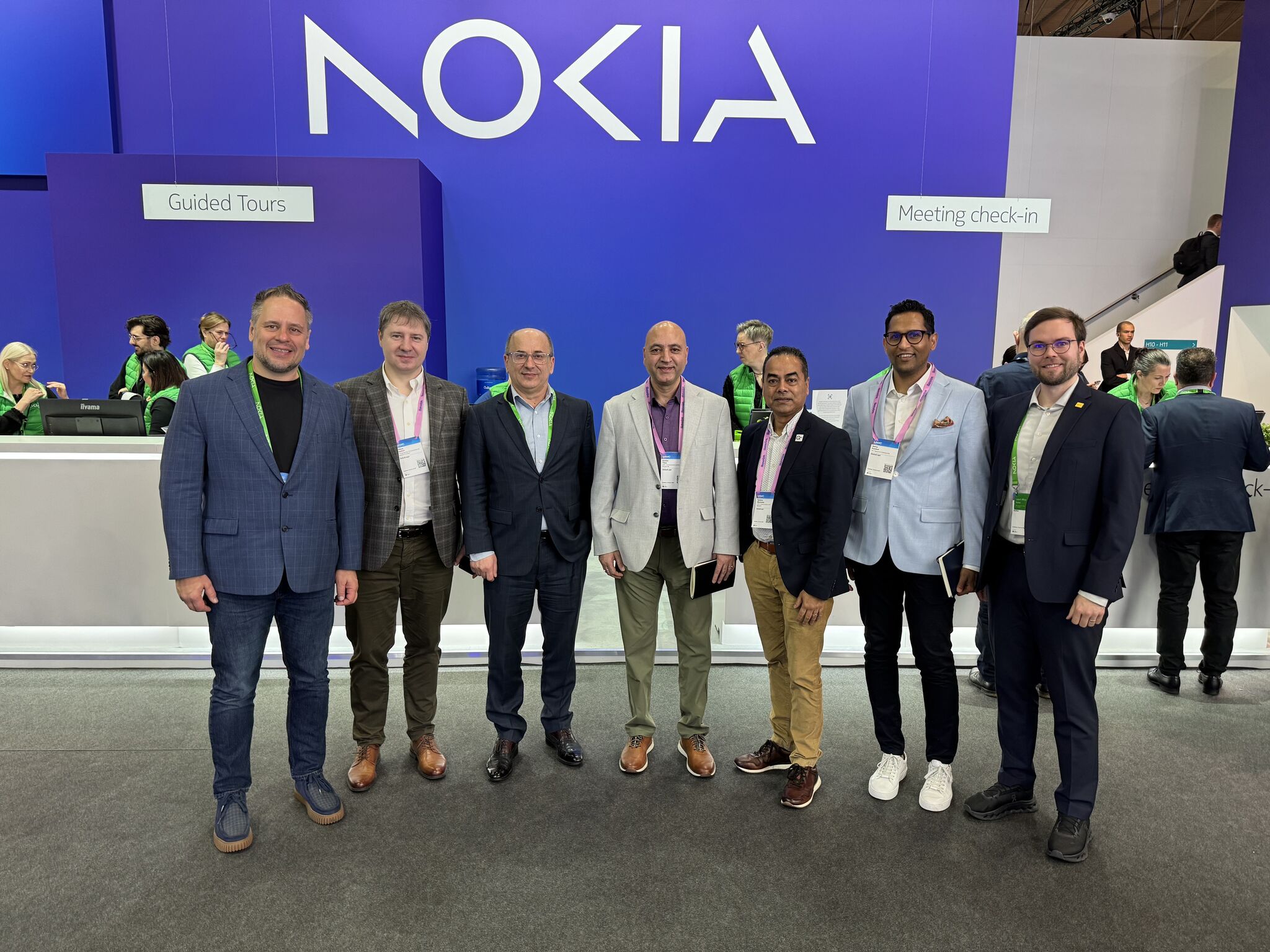 Lauri Alho and other Nokia and GlobalLogic leaders at MWC 2026 in a group photo, discussing advancements in Network as Code and AI-native infrastructure.