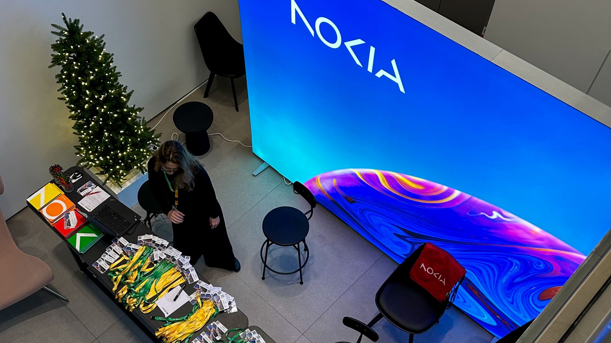 Nokia Greece Amplify 2023 event in Athens, showcasing Nokia products and services, with a prominent Nokia-branded display and an attendee registration desk.
