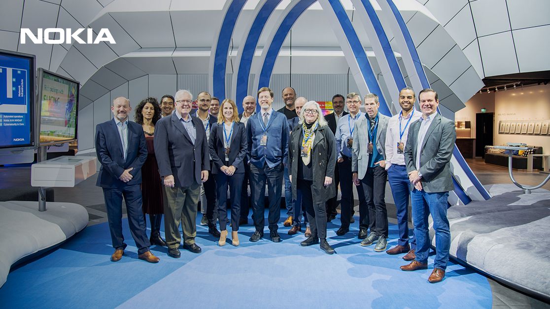 Group photo of Lauri Alho, industry analysts and Nokia Core User Group members at the Nokia Executive Experience Center in Espoo.