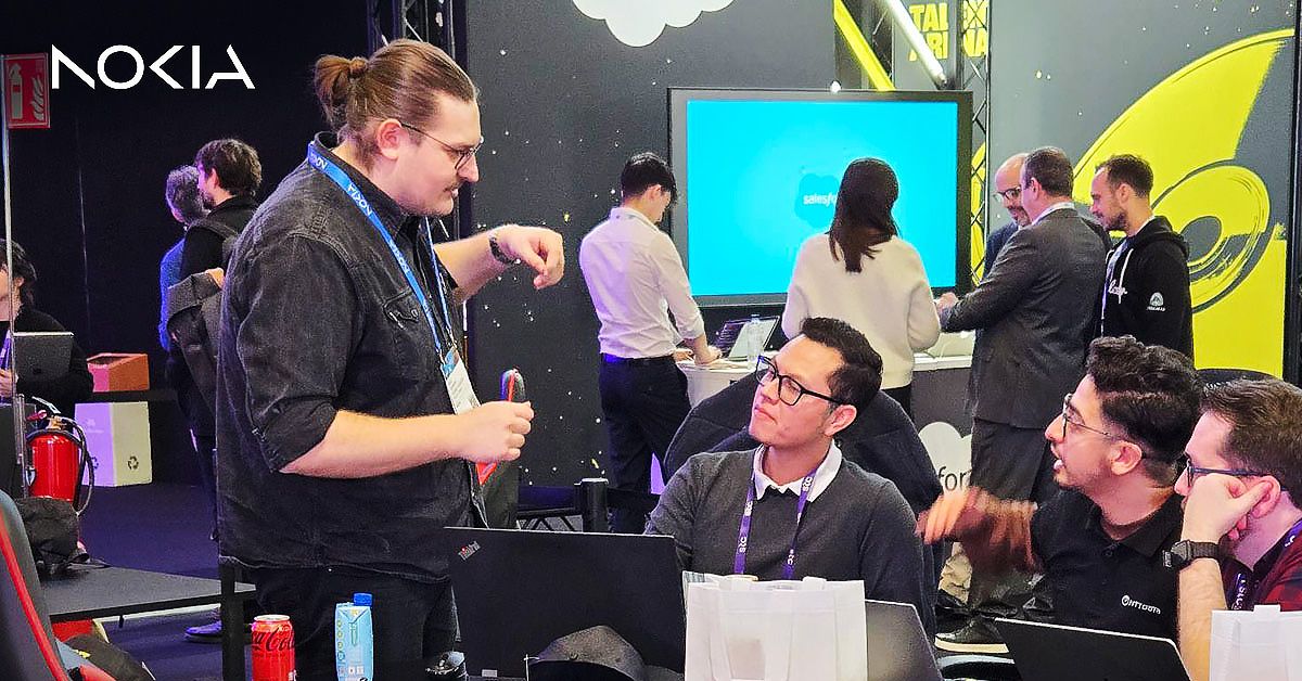 Nokia developers and participants engaging in demos and discussions for the Network as Code solution at the GSMA Open Gateway Hackathon during MWC24.