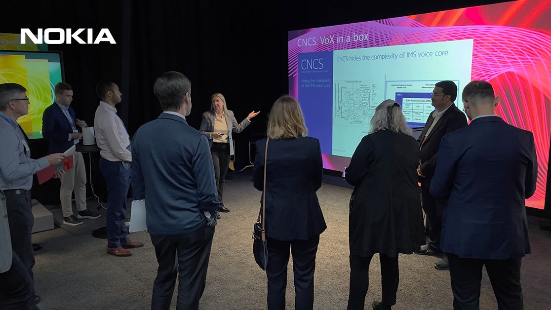 Industry analysts at Nokia's Executive Experience Center in Espoo being presented with the Core Networks 'Vision 2025' strategy, featuring CNCS technology. Lauri Alho is on the left preparing for his presentation.