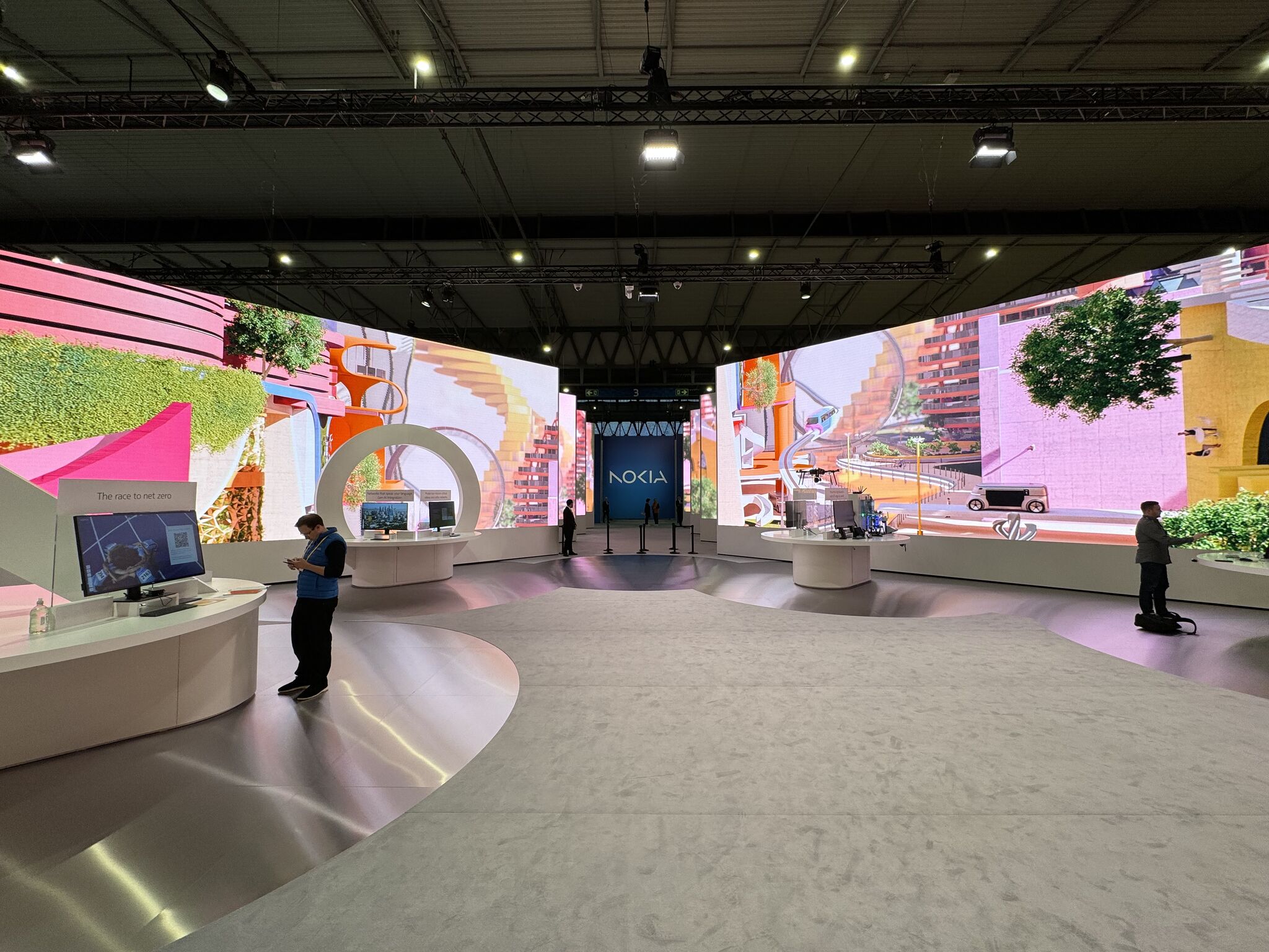 Nokia's expansive public area at Mobile World Congress 2024 in Barcelona, featuring multiple interactive demonstrations of their latest technologies, including Network as Code.