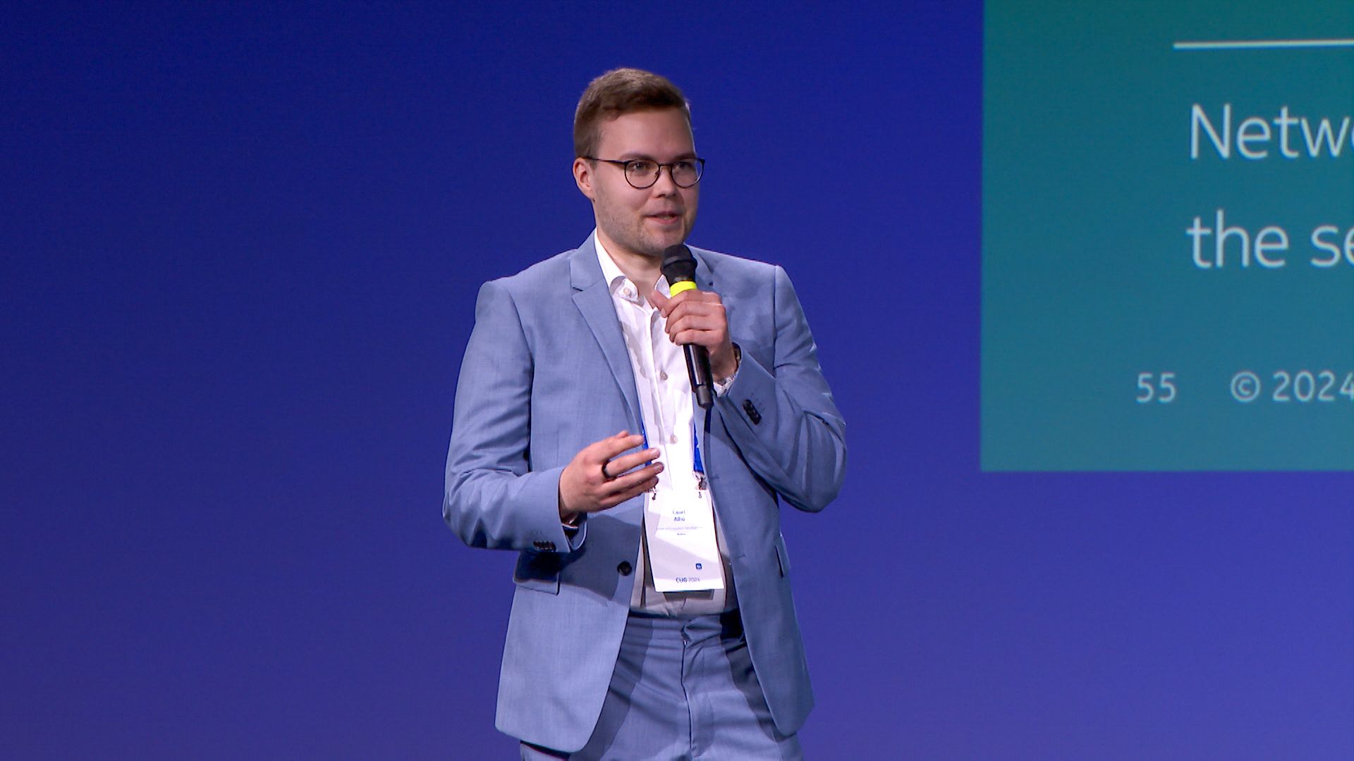 Lauri Alho presenting Nokia Network as Code capabilities, including Quality on Demand, at Nokia Core User Group 2024, discussing the Elisa 5G network and Elmo teledriving demonstration.