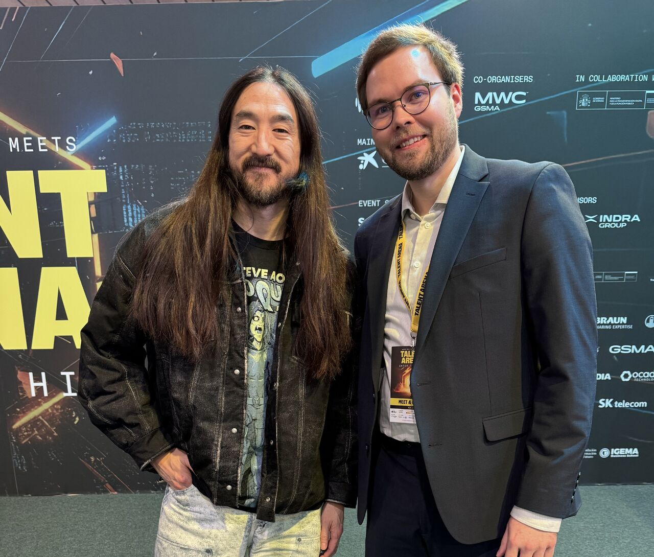 Lauri Alho and Steve Aoki at MWC26 Talent Arena, discussing cross-disciplinary creativity for AI-native infrastructure and Network as Code.