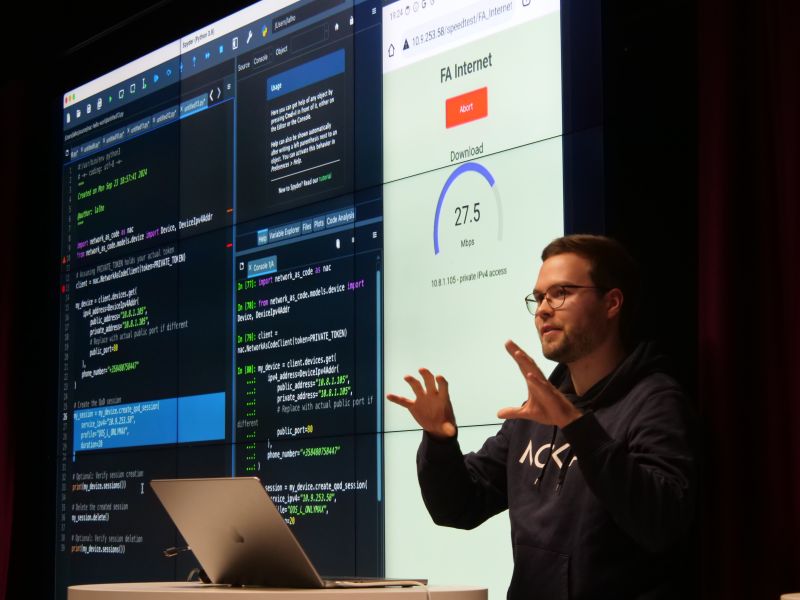Lauri Alho presents AI integration with the Nokia Network as Code platform, showcasing live code and network performance during AI Technology Day at Nokia Arena.
