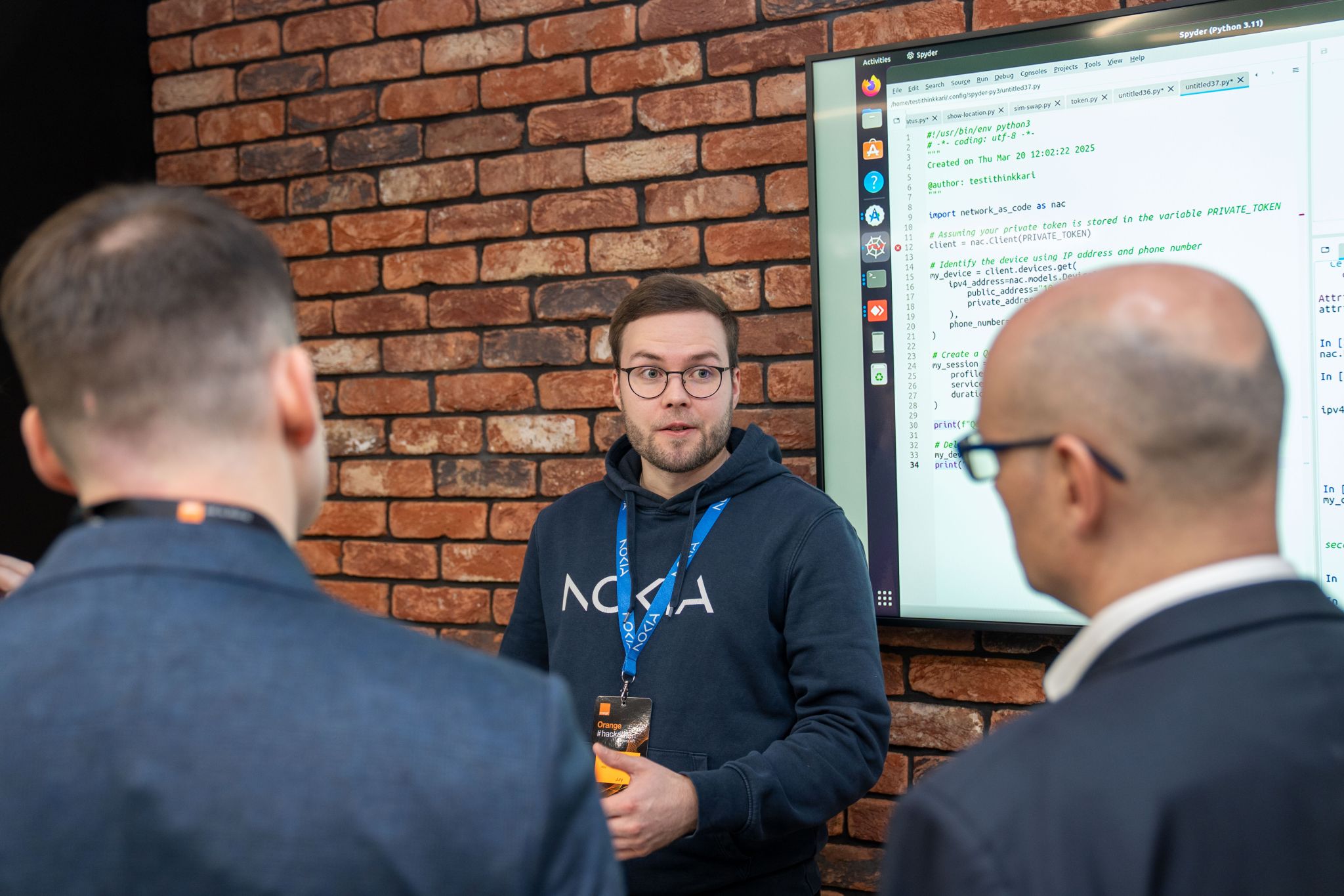 Lauri Alho, representing Nokia, presents a live demo of Network as Code using Python during the Orange Camara API Hackathon in Warsaw, Poland.